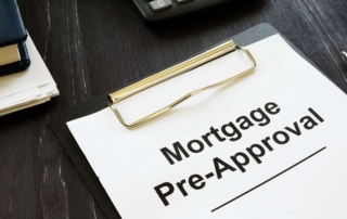 Mortgage Pre-Approval papers on a clipboard sitting on a desk.